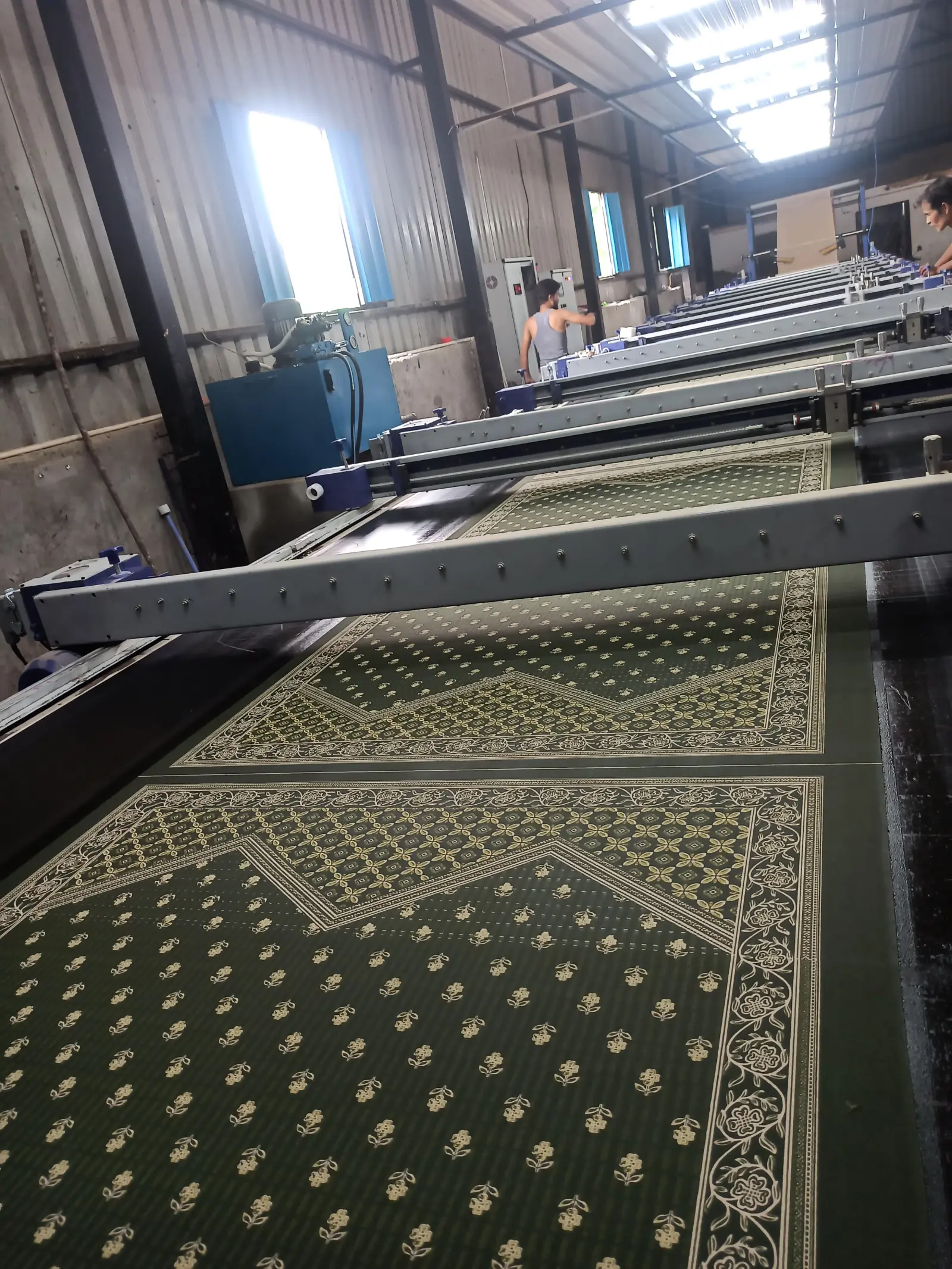 Continuous green printed fabric yardage at Vedic Vastram factory