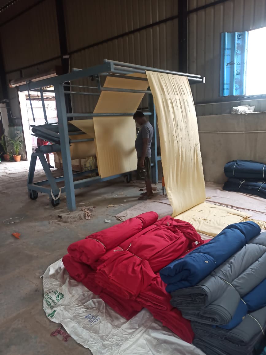 Fabric inspection and folding station